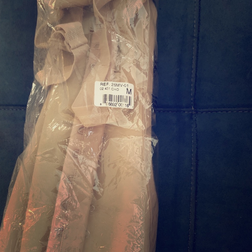 Never worn ‘Squeem” waist shaper.